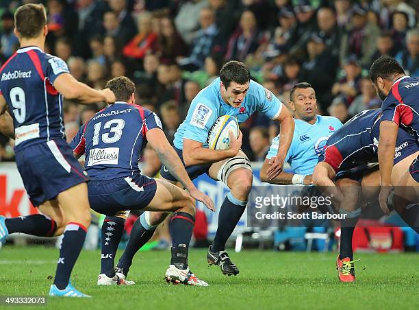 Dave Dennis of the Waratahs is tackled during the round 15 Super Rugby match between the Rebels and the Waratahs at AAMI Park on May 23, 2014 in...