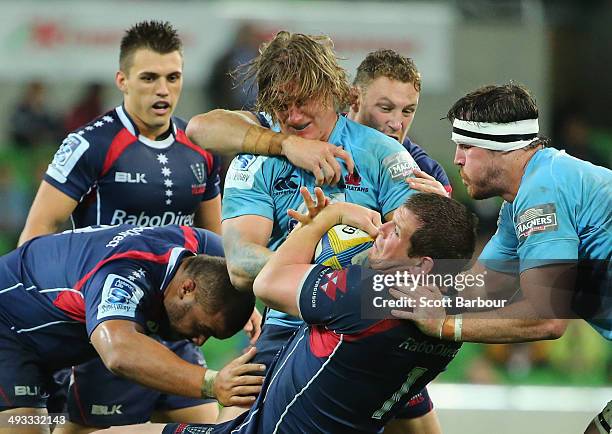 Toby Smith of the Rebels is tackled during the round 15 Super Rugby match between the Rebels and the Waratahs at AAMI Park on May 23, 2014 in...