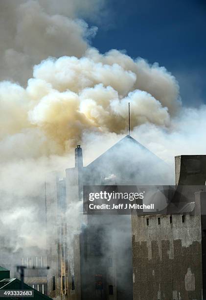 Smoke rises into the sky after a fire broke out at the Glasgow School of Art Charles Rennie Mackintosh Building on May 23, 2014 in Glasgow, Scotland....