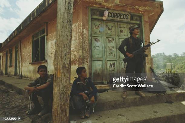 Guerrilla fighters at a post office in El Salvador, during the Salvadoran Civil War, 1989.