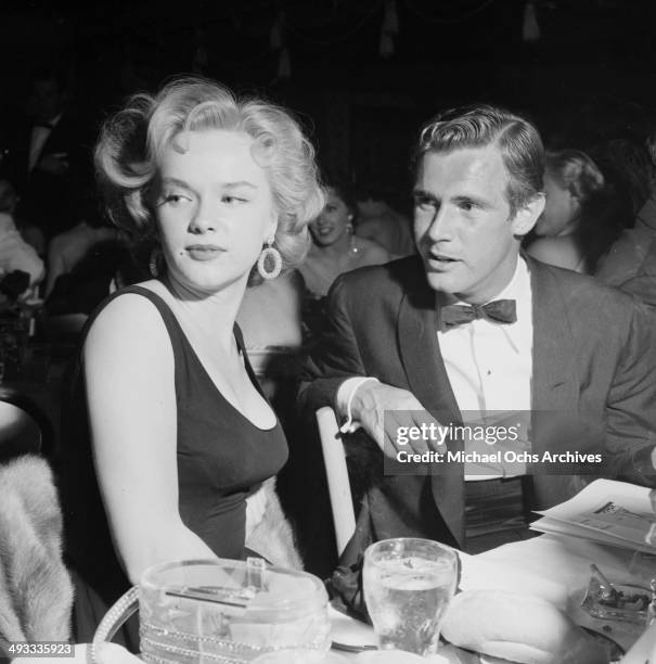 Actress Anne Francis and John Lupton attend a party in Los Angeles, California.