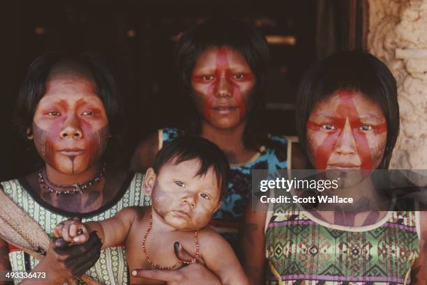 Kayapo women with a baby in the Amazon Basin, Brazil, 1992.