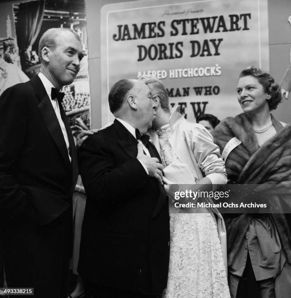 Director Alfred Hitchcock with actor Jimmy Stewart and actress Doris Day at the premier of "The Man Who Knew Too Much" in Los Angeles, California.