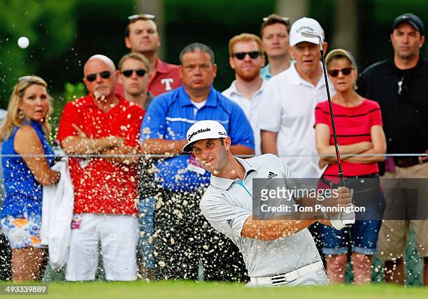 Dustin Johnson plays his shot out of the bunker on the 3rd hole during Round Two of the Crowne Plaza Invitational at Colonial on May 23, 2014 at...