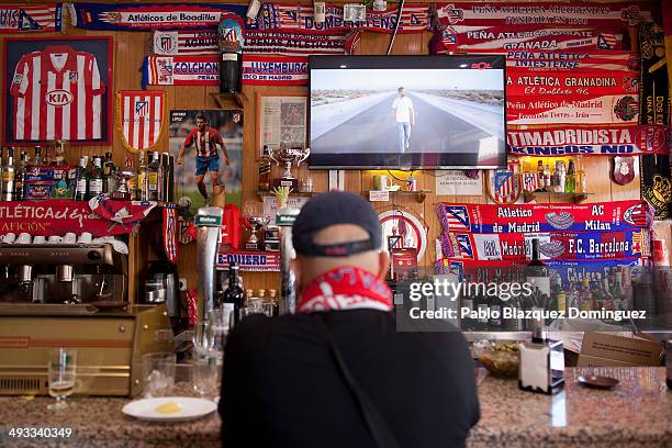 An Atletico de Madrid fan stands at El Doblete bar a day before the UEFA Champions league Final of Real Madrid against Atletico de Madrid on May 23,...