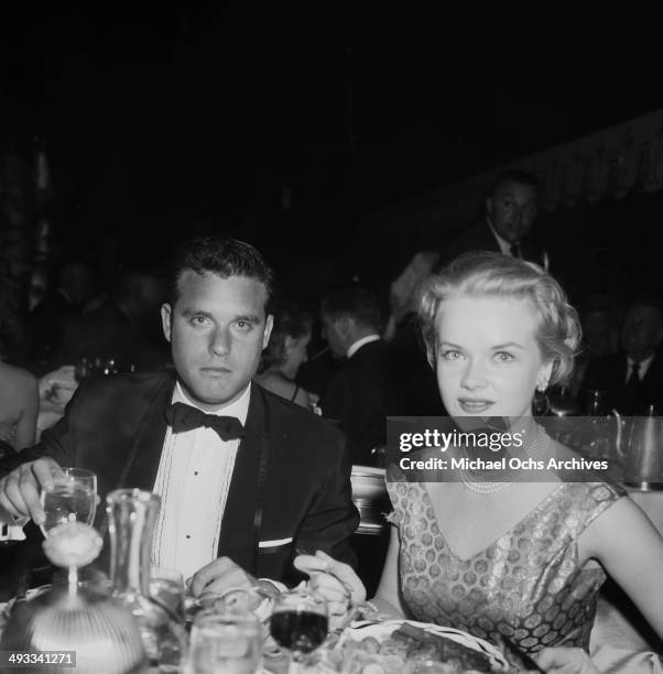 Actress Anne Francis and Buddy Bregman attend the re-opening of Coconut Grove in Los Angeles, California.