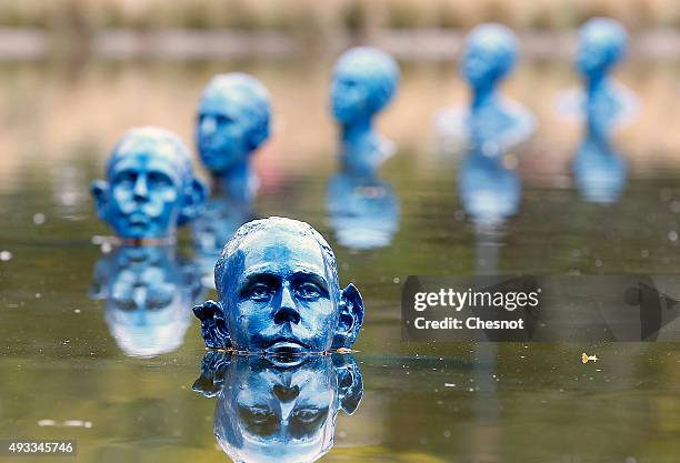 Where the Tides Ebb and Flow" installation of 35 blue clone sculptures by Argentine artist Pedro Marzorati at the Park Montsouris on October 19, 2015...