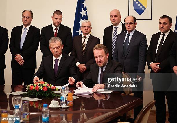 Leader of Party of Democratic Action Bakir Izetbegovic and Leader of Union for a Better Future Fahrudin Radoncic sign a coalition agreement in...