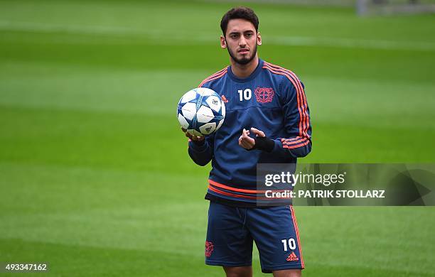 Leverkusen's midfielder Hakan Calhanoglu takes part in a training session on the eve of the Group E, first-leg UEFA Champions League football match...