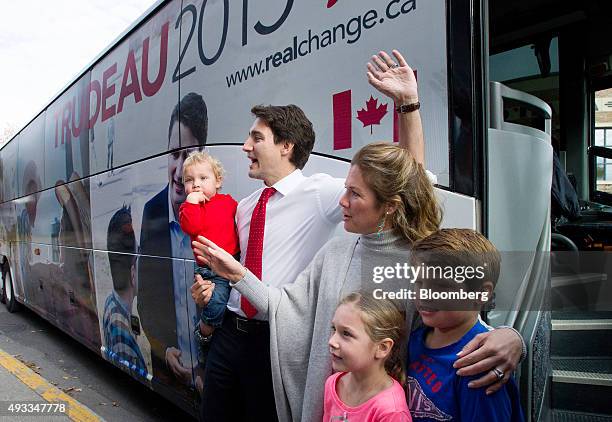 Justin Trudeau, leader of the Liberal Party of Canada, left, and wife Sophie Gregoire-Trudeau wave with their children after casting his ballot on...