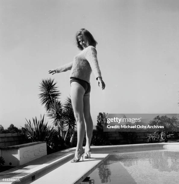 Actress Barbara Hines poses by the pool in Los Angeles, California.