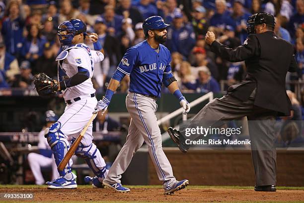 Toronto Blue Jays Jose Bautista reacts after being called out on strikes during the fourth inning against the Kansas City Royals in Game 1 of MLB's...