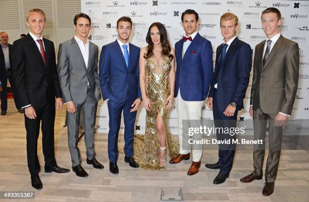 Tamara Ecclestone poses with F1 drivers Max Chilton, Esteban Gutierrez, Jules Bianchi, Adrian Sutil, Marcus Ericsson and Daniil Kyvat at the Amber...