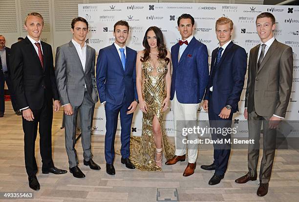 Tamara Ecclestone poses with F1 drivers Max Chilton, Esteban Gutierrez, Jules Bianchi, Adrian Sutil, Marcus Ericsson and Daniil Kyvat at the Amber...