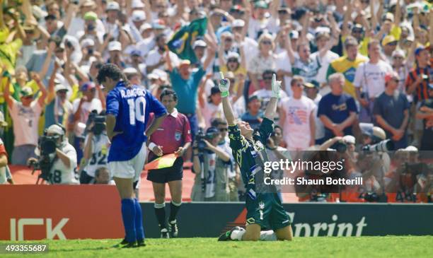 Brazil goalkeeper Taffarel celebrates after Roberto Baggio of Italy had missed his penalty to decide the FIFA World Cup Final 1994 between Brazil and...