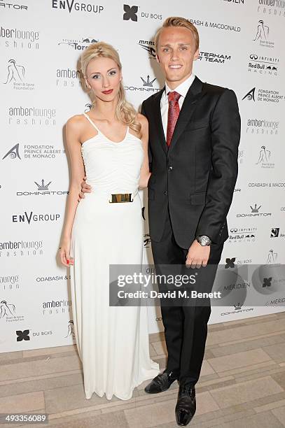 Driver Max Chilton and Chloe Roberts attend the Amber Lounge 2014 Gala at Le Meridien Beach Plaza Hotel on May 23, 2014 in Monaco, Monaco.