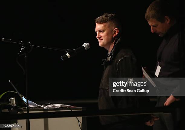 Tommy Robinson of the English Defense League speaks to supporters of the Pegida movement gathered on the first anniversary since the first Pegida...