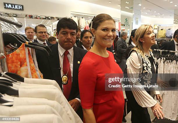 Crown Princess Victoria of Sweden smiles during a visit to H&M store at Jockey Plaza on October 19, 2015 in Lima, Peru.