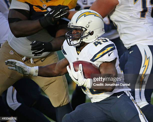 Branden Oliver of the San Diego Chargers runs against the Green Bay Packers at Lambeau Field on October 18, 2015 in Green Bay, Wisconsin. The Packers...