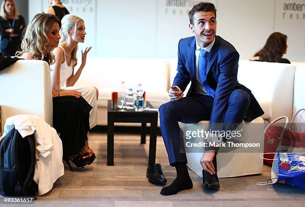 Jules Bianchi of France and Marussia prepares to take part in the Amber Lounge Fashion Show ahead of the Monaco Formula One Grand Prix at Circuit de...