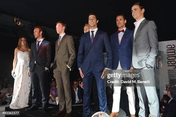 Natalie Pinkham and racing drivers Jean-Eric Vergne, Daniil Kvyat, Max Chilton, Daniel Ricciardo, Adrian Sutil and Esteban Gutierrez pose on the...