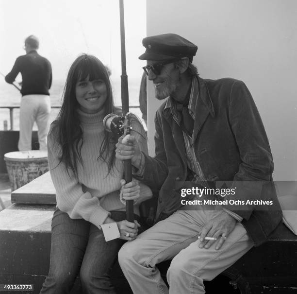 Actress Barbara Hershey sits with Earl Leaf at a pier in Los Angeles, California.