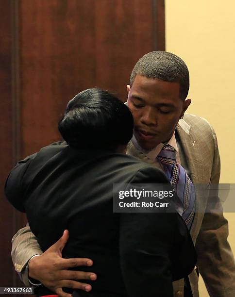 Running back Ray Rice of the Baltimore Ravens hugs his motherJanet Rice after addressing a news conference with his wife Janay at the Ravens training...