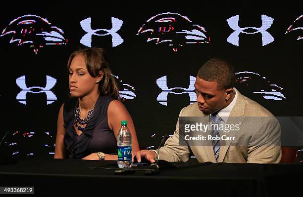 Running back Ray Rice of the Baltimore Ravens looks over his notes while addressing a news conference with his wife Janay at the Ravens training...