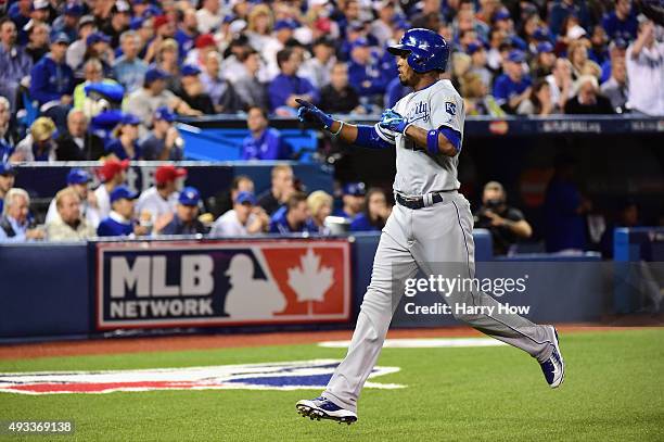 Alcides Escobar of the Kansas City Royals celebrates after scoring a run in the first inning against the Toronto Blue Jays during game three of the...