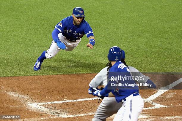 Kevin Pillar of the Toronto Blue Jays scores a run in the second inning against the Kansas City Royals during game three of the American League...