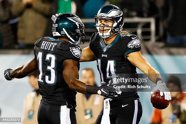 Riley Cooper of the Philadelphia Eagles is congratulated by his teammate Josh Huff after scoring a first quarter touchdown against the New York...
