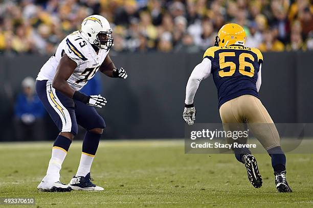 Chris Hairston of the San Diego Chargers works against Julius Peppers of the Green Bay Packers during a game at Lambeau Field on October 18, 2015 in...