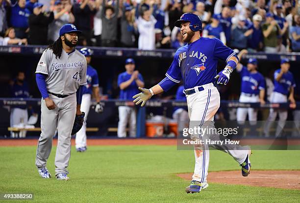 Russell Martin of the Toronto Blue Jays celebrates after scoring a run in the third inning against the Kansas City Royals during game three of the...