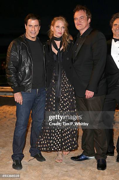 John Travolta, Uma Thurman and Quentin Tarantino attend a screening of Pulp Fiction at the 67th Annual Cannes Film Festival on May 23, 2014 in...