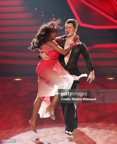 Motsi Mabuse and Evgenij Voznyuk attend the 8th Show of 'Let's Dance' on May 23, 2014 in Cologne, Germany.