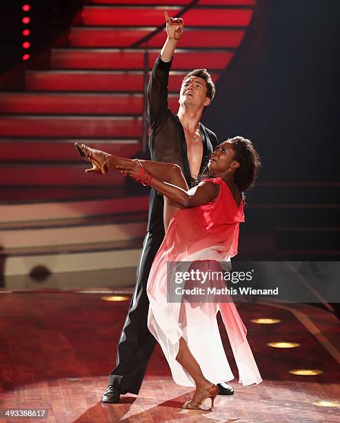 Motsi Mabuse and Evgenij Voznyuk attend the 8th Show of 'Let's Dance' on May 23, 2014 in Cologne, Germany.