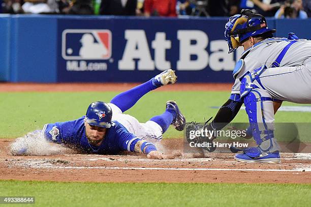 Kevin Pillar of the Toronto Blue Jays scores a run in the second inning against the Kansas City Royals during game three of the American League...