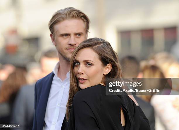 Actors Boyd Holbrook and Elizabeth Olsen arrive at the Los Angeles premiere of 'Godzilla' at Dolby Theatre on May 8, 2014 in Hollywood, California.