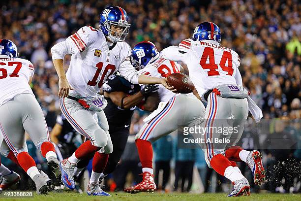 Andre Williams of the New York Giants takes the handoff from Eli Manning during the second quarter against the Philadelphia Eagles at Lincoln...