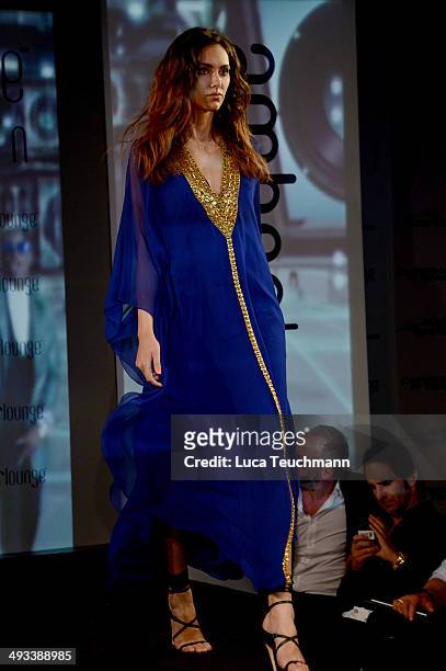 Model walks the runway at the Amber Lounge 2014 Gala at Le Meridien Beach Plaza Hotel on May 23, 2014 in Monte-Carlo, Monaco.