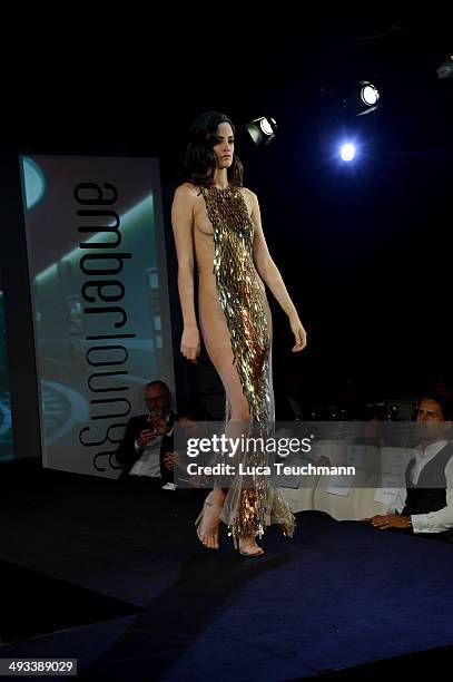 Model walks the runway at the Amber Lounge 2014 Gala at Le Meridien Beach Plaza Hotel on May 23, 2014 in Monte-Carlo, Monaco.