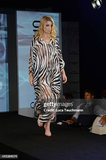 Model walks the runway at the Amber Lounge 2014 Gala at Le Meridien Beach Plaza Hotel on May 23, 2014 in Monte-Carlo, Monaco.