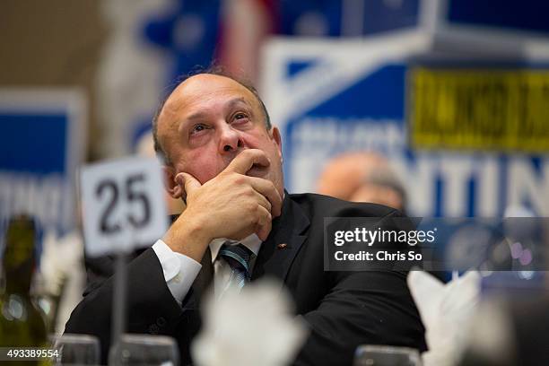 Julian Fantino supporter Michael Tibollo checks the early results at Fontana Primavera Event Centre in the Vaughan-Woodbridge after the polls have...