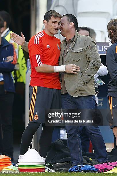 Iker Casillas of Real Madrid greets former player Pedja Mijatovic during a Real Madrid training session ahead of the UEFA Champions League Final...