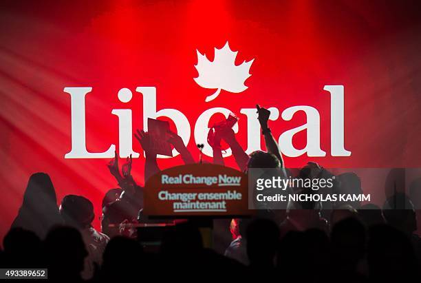 Supporters of Canadian Liberal Party leader Justin Trudeau cheer as results show the Liberals ahead in the general elections in Montreal on October...