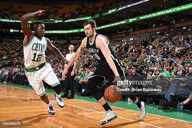 Sergey Karasev of the Brooklyn Nets drives to the basket against Terry Rozier of the Boston Celtics during the preseason game on October 19, 2015 at...