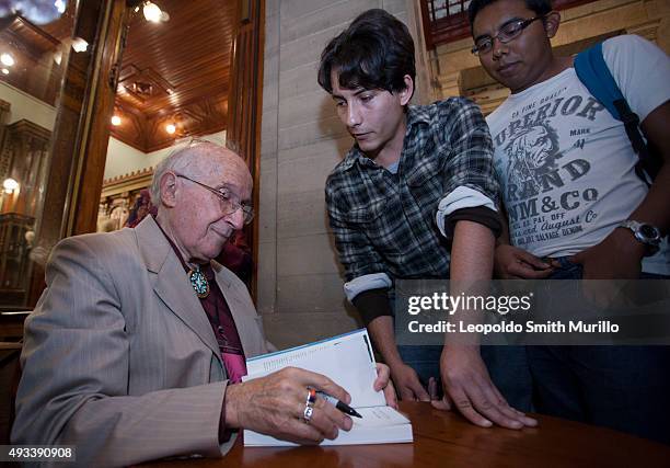 Nobel Laureate Roald Hoffmann signs a book during the conference "La química del arte y el arte de la química" as part of the 43° Edition of...