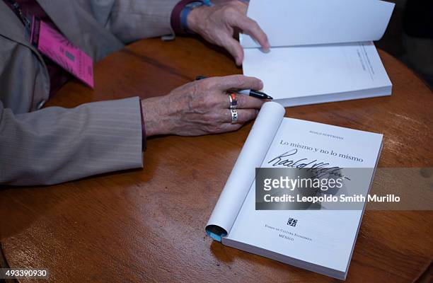 Detail of hands of Nobel Laureate Roald Hoffmann as he signs a book during the conference "La química del arte y el arte de la química" as part of...