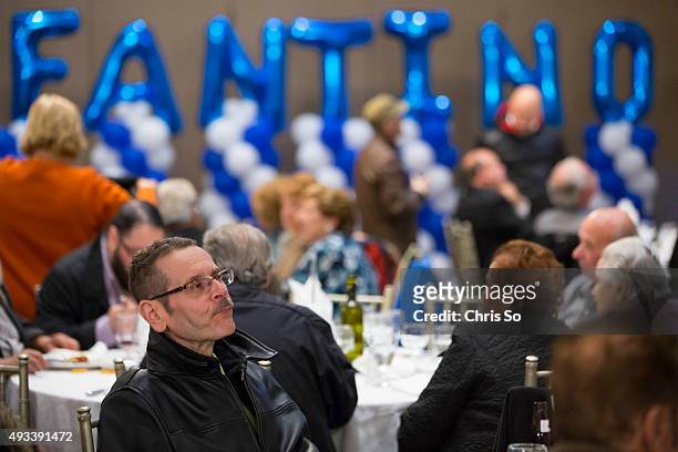 Somber Julian Fantino supporters follow the election results projected at Fontana Primavera Event Centre in the Vaughan-Woodbridge after the polls...