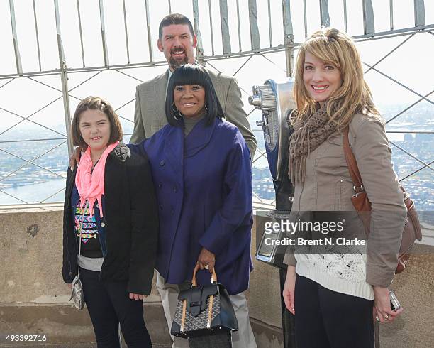 Cancer survivor Emily Whitehead, Tom Whitehead, singer Patti LaBelle and Kari Whitehead visit The Empire State Building in honor of Gabrielle's Angel...